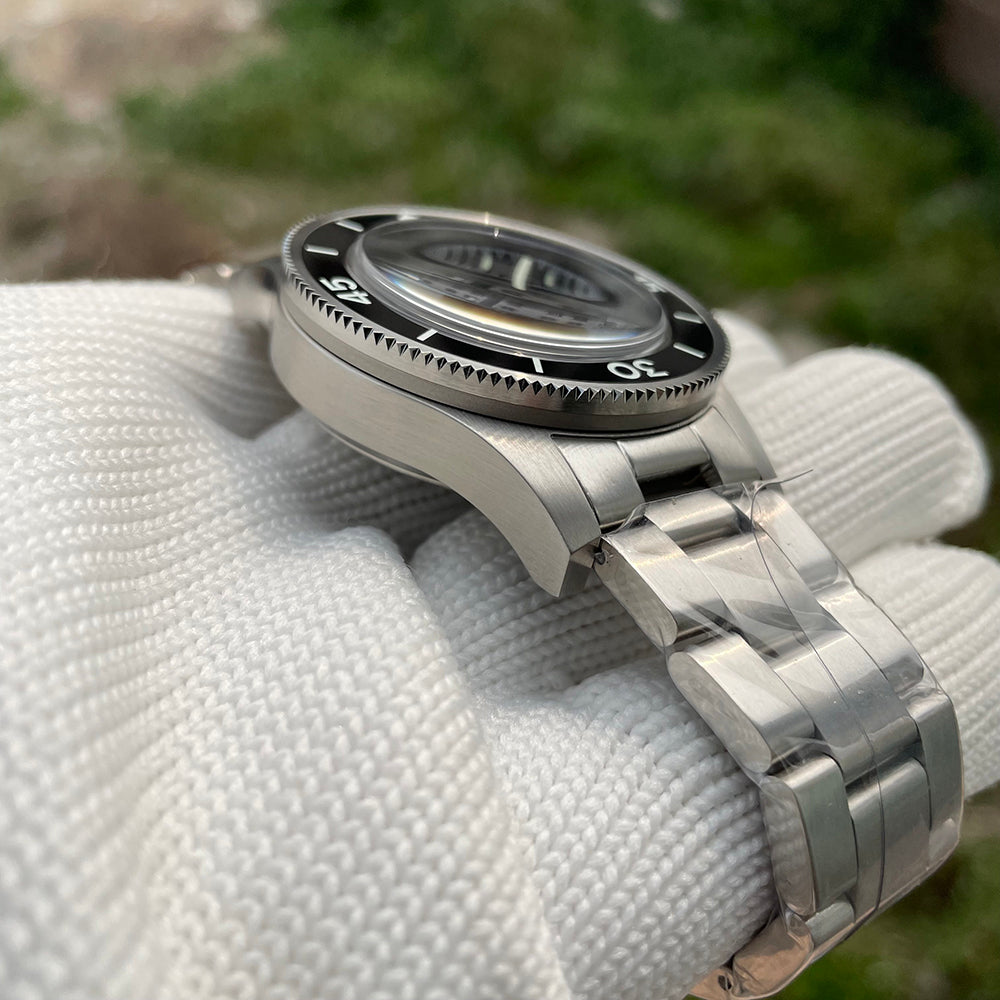 Steeldive SD1952 fifty fathoms diver side view with brushed steel bracelet and clasp, outdoor
