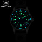 Steeldive SD1952 fifty fathoms watch glowing green and blue lume in the dark, date visible at 4:30
