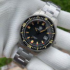 Steeldive SD1952T 300M angled macro of black 60-click bezel, yellow markers and steel bracelet