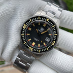 Steeldive SD1952T dial macro with cream lume indices, red accents and 300M automatic text
