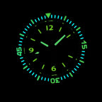 Steeldive SD1952T dive watch lume shot showing green and blue glow on indices and bezel