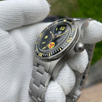 Steeldive SD1952T with black dial on stainless steel bracelet, three-quarter side view