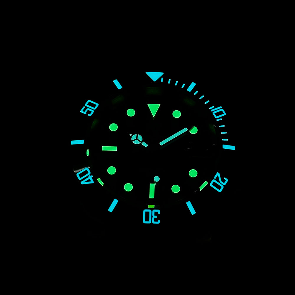 Steeldive SD1953S dive watch dial glowing green and blue C3 lume in the dark, low-light view
