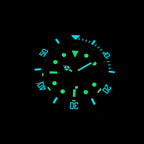 Steeldive SD1953S dive watch dial glowing green and blue C3 lume in the dark, low-light view