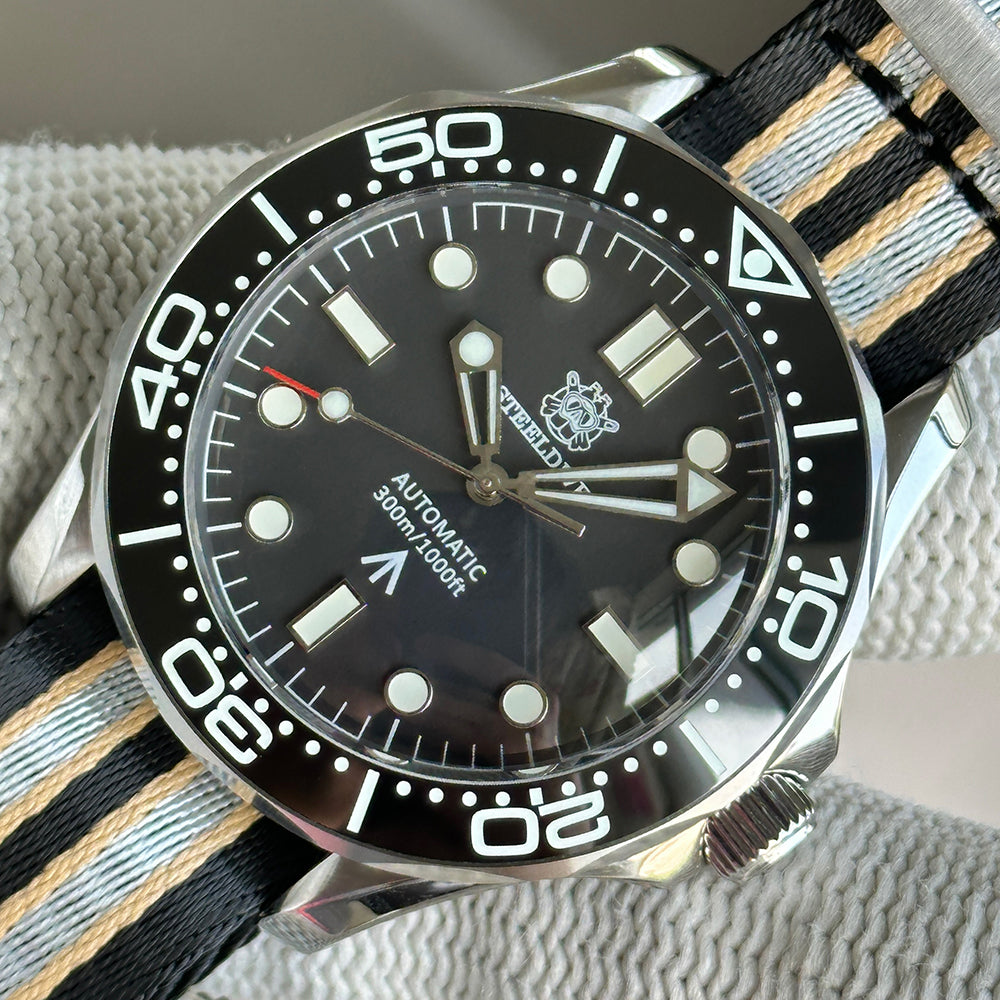 STEELDIVE SD1957L black dial dive watch on a black, grey and sand striped nylon strap