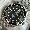 STEELDIVE SD1957L black dial dive watch with black ceramic bezel on a stainless steel bracelet