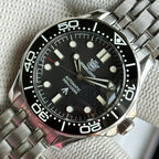 STEELDIVE SD1957L black dial dive watch with black ceramic bezel on a stainless steel bracelet