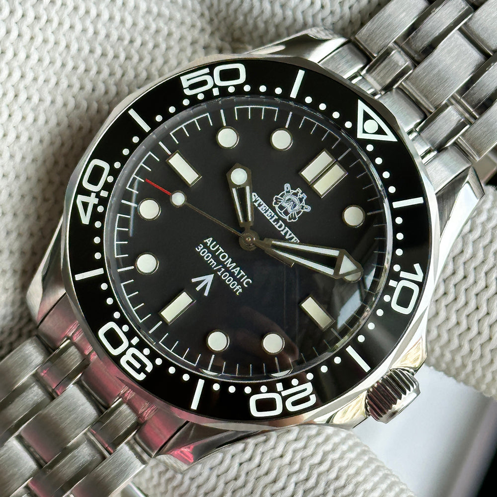 STEELDIVE SD1957L black dial dive watch with black ceramic bezel on a stainless steel bracelet