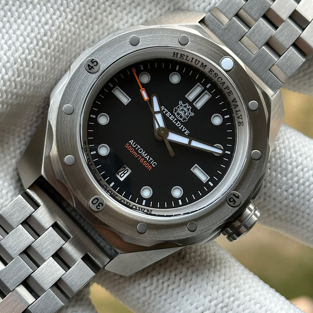 Steeldive SD1960 reference build with black dial on steel bracelet, donor watch example