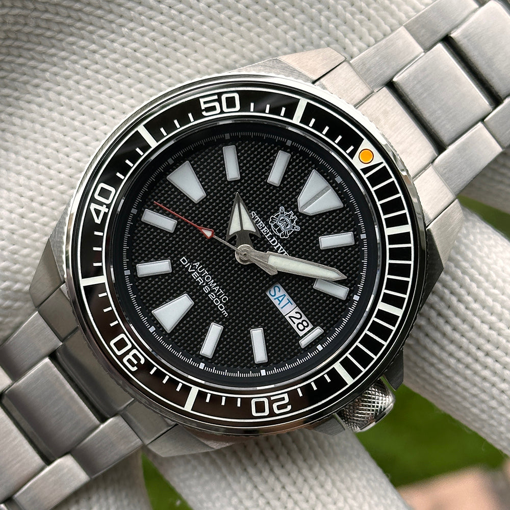 Steeldive SD1961 ceramic bezel insert mounted on host diver watch, side angle showing crown and case