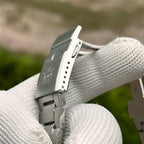 Steeldive SD1961 22mm bracelet clasp underside with diver extension blade and turtle stamp, macro view