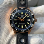 Steeldive SD1962S black ceramic bezel macro, applied bronze hands over black dial closeup