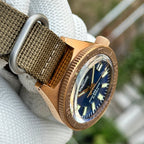 Steeldive SD1962S bronze case lug and crown macro on khaki nato strap, crown detail