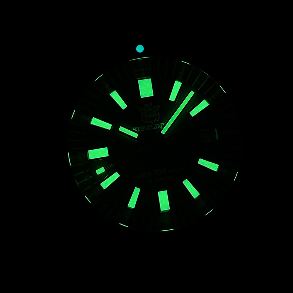 Steeldive SD1962S bronze diver lume shot, green C3 lume glow on dial indices in darkness