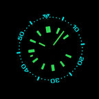Steeldive SD1962S lume shot, blue bezel pip glow and green dial lume in darkness