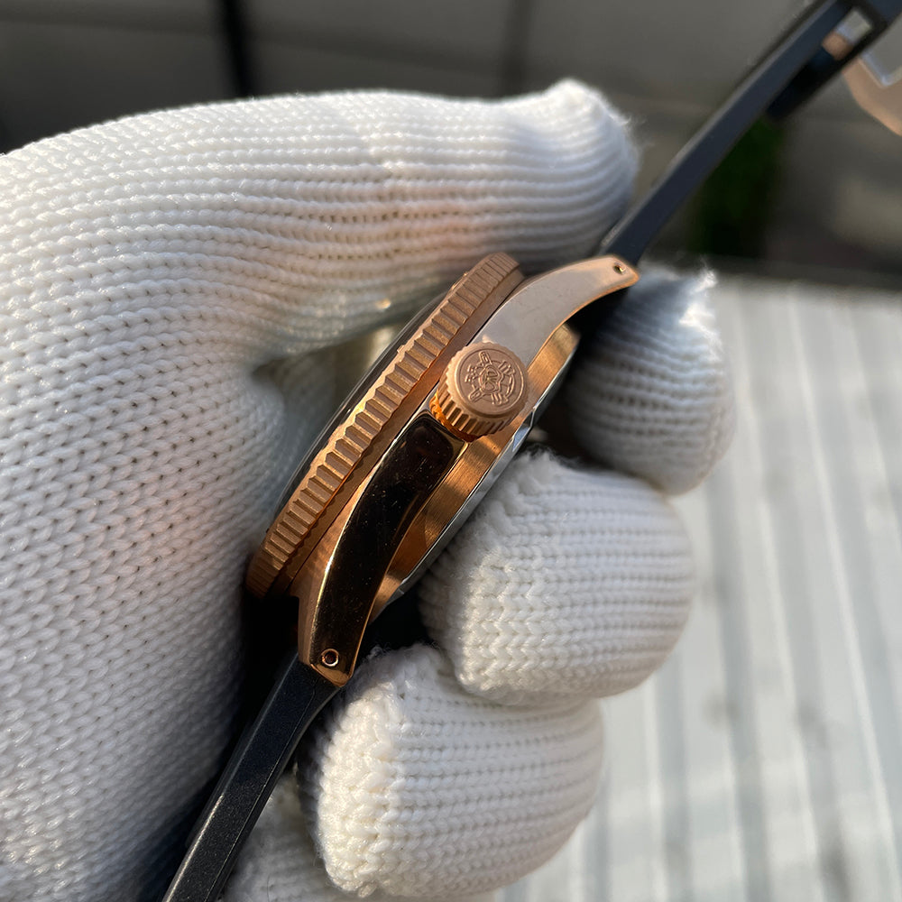 Steeldive SD1962S crown detail, screw-down bronze crown engraved with diver helmet logo