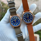 Two Steeldive SD1962S bronze watches on khaki nato and tan leather straps side by side, comparison