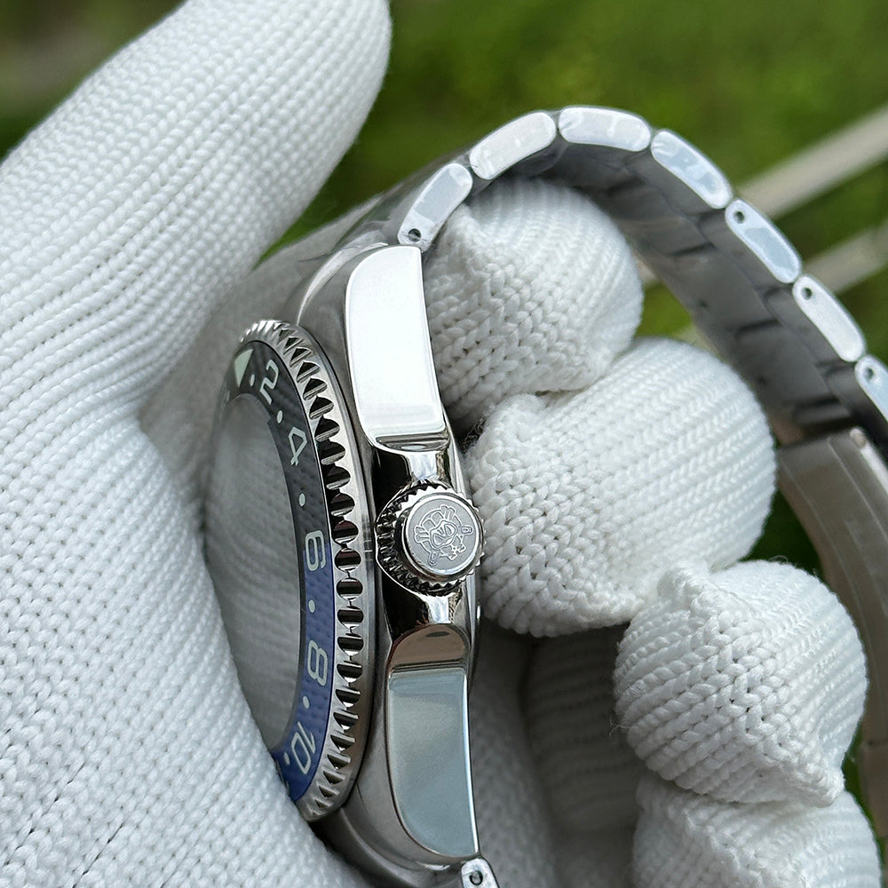Steeldive SD1964GMT side profile showing engraved screw-down crown and blue Batman ceramic bezel edge