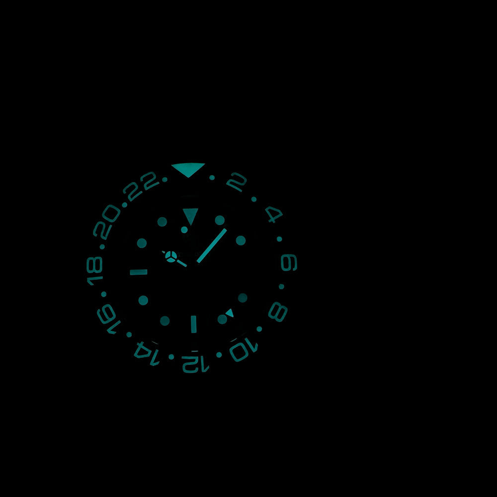 Steeldive SD1964GMT dive watch lume shot showing strong teal C3 SuperLuminova glow in darkness