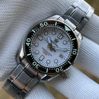 Steeldive SD1968 dive watch white dial close-up on stainless steel bracelet