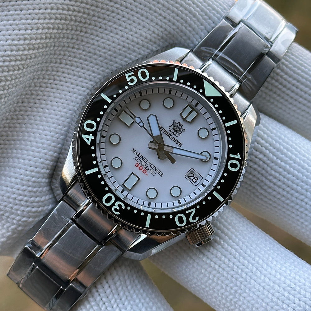 Steeldive SD1968 dive watch white dial close-up on stainless steel bracelet