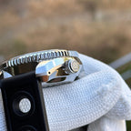 Steeldive SD1968 dive watch crown side profile with black rubber strap outdoors