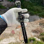 Steeldive SD1969 Proplof watch with black rubber strap unfastened showing buckle and perforations