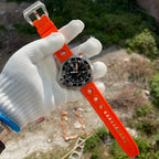 Steeldive SD1969 Proplof watch with orange rubber strap unfastened showing signed steel buckle