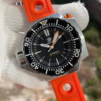Steeldive SD1969 Proplof dive watch on bright orange rubber strap, outdoor close-up wrist view