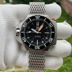 Steeldive SD1969 Proplof watch on stainless shark mesh bracelet, hand-held outdoor close-up