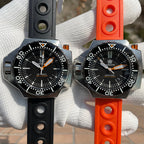 Two Steeldive SD1969 Proplof watches side by side on black rubber and orange rubber dive straps