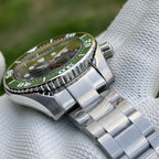 Steeldive SD1971GMT GMT watch with green ceramic bezel and steel bracelet, angled detail view