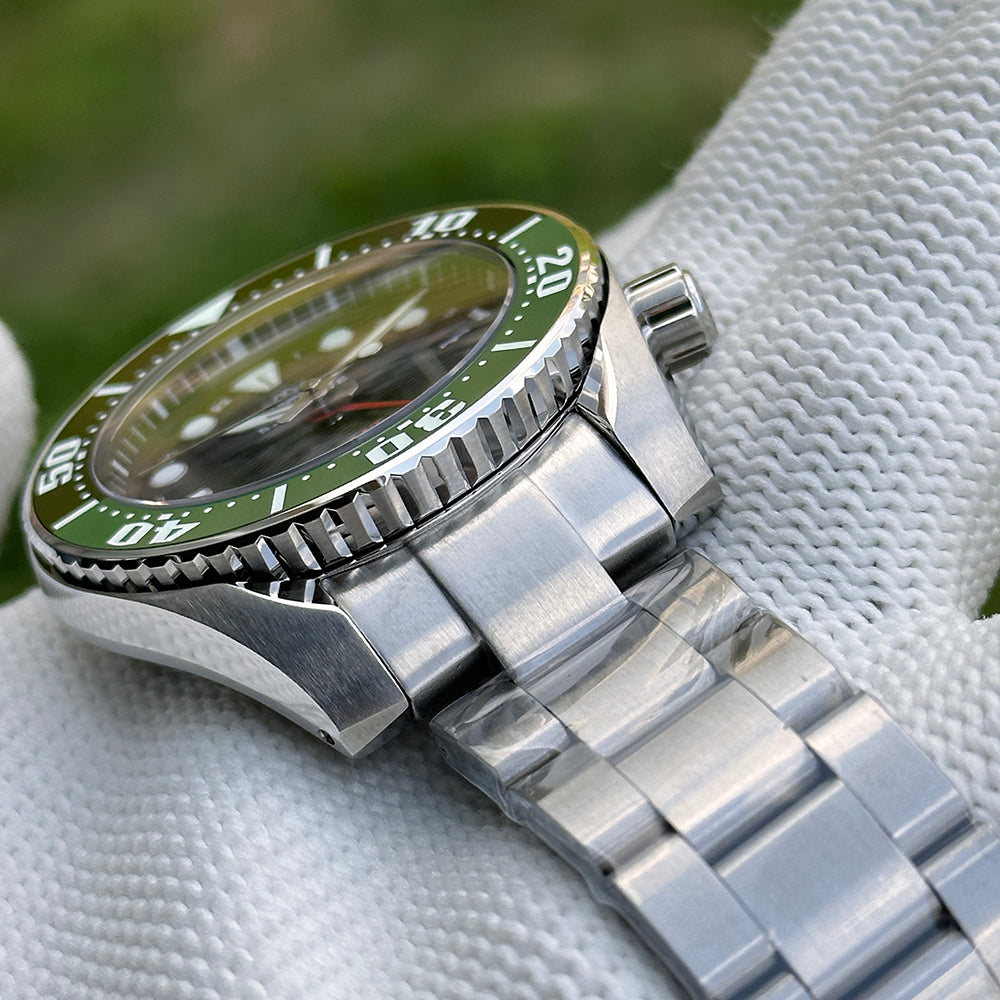 Steeldive SD1971GMT GMT watch with green ceramic bezel and steel bracelet, angled detail view
