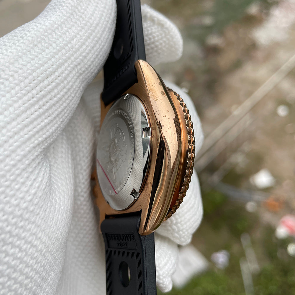 Steeldive SD1973S bronze watch case from the side showing engraved steel caseback and bronze coin-edge bezel