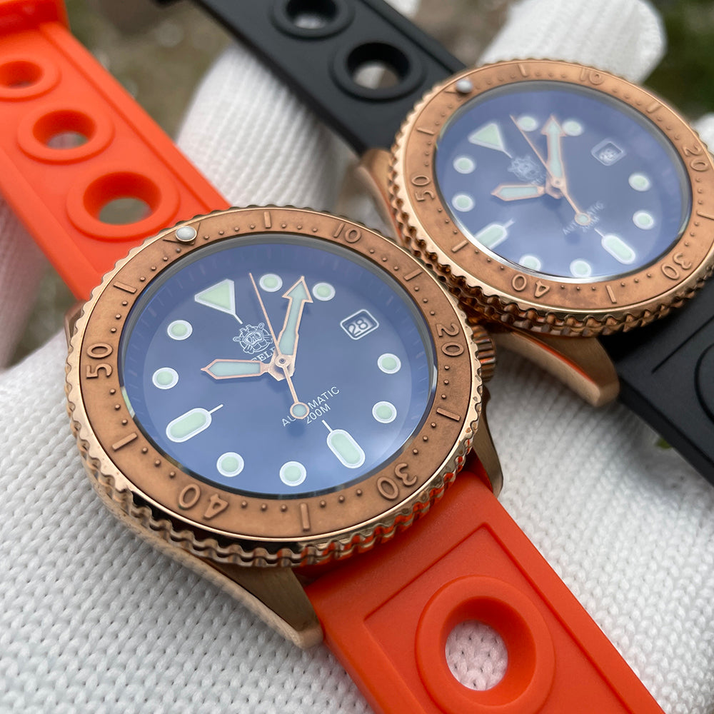 Steeldive SD1973S bronze dive watches angled pair shot, orange strap front, black strap behind