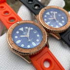 Steeldive SD1973S bronze dive watches angled pair shot, orange strap front, black strap behind