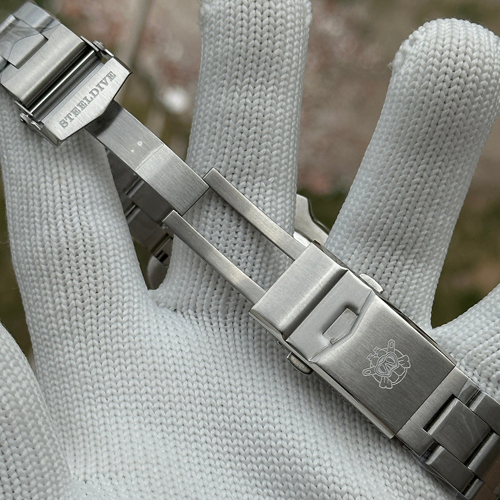 Steeldive SD1974 steel bracelet diver clasp opened showing micro-adjust holes and safety lock