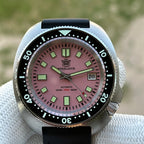 Steeldive SD1974 turtle case pink dial on black rubber dive strap, front macro