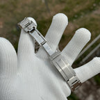 Steeldive SD1974 sapphire dive watch steel bracelet clasp opened on a white gloved hand
