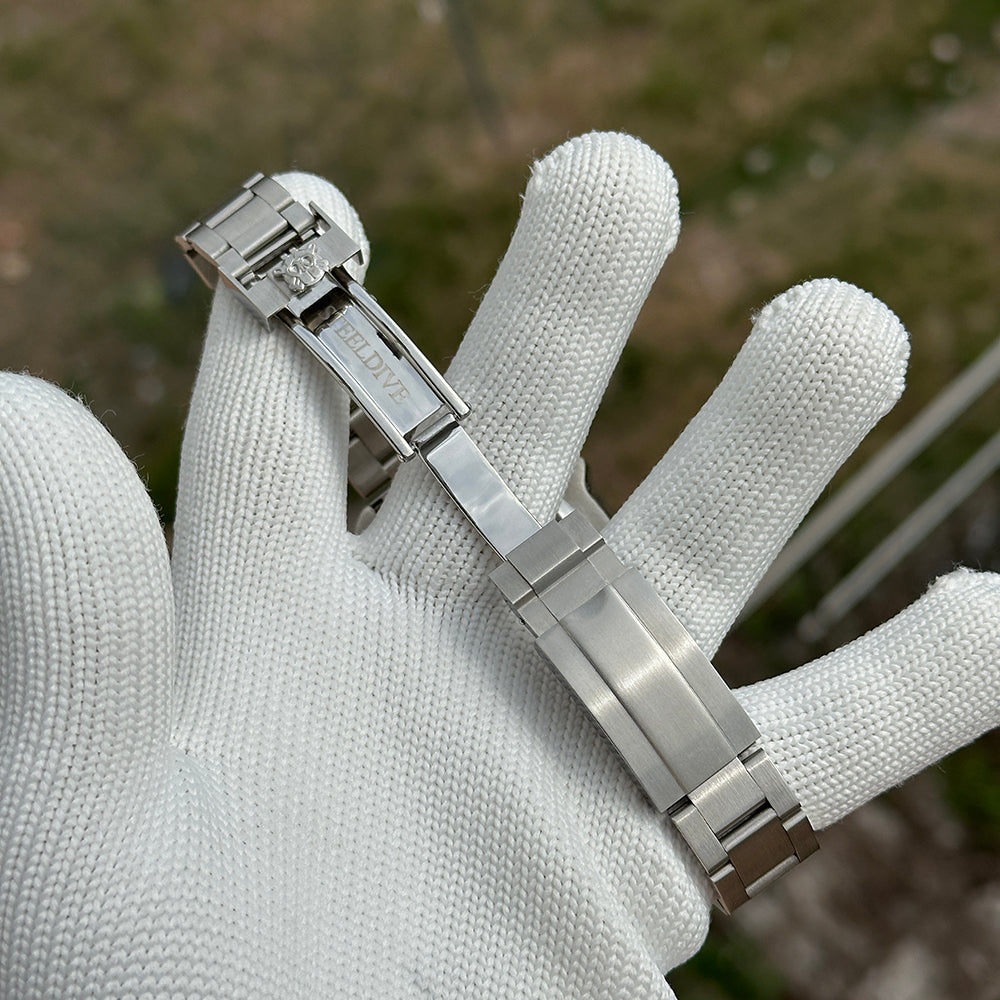 Steeldive SD1974 sapphire dive watch steel bracelet clasp opened on a white gloved hand