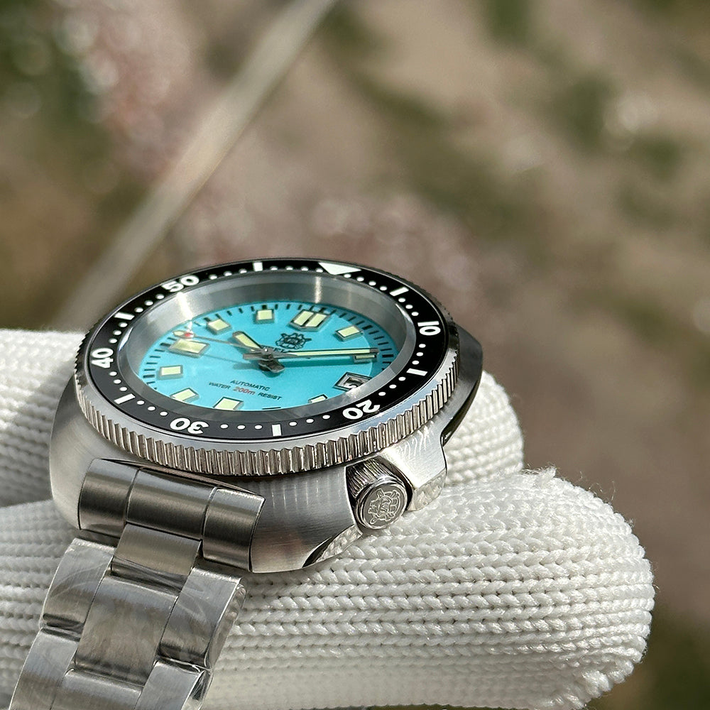 Steeldive SD1974 sapphire cyan dial dive watch crown and case side detail with engraved screw-down crown
