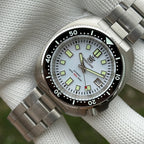 Steeldive SD1974 sapphire dive watch with white dial, three-quarter angle view of case and bracelet