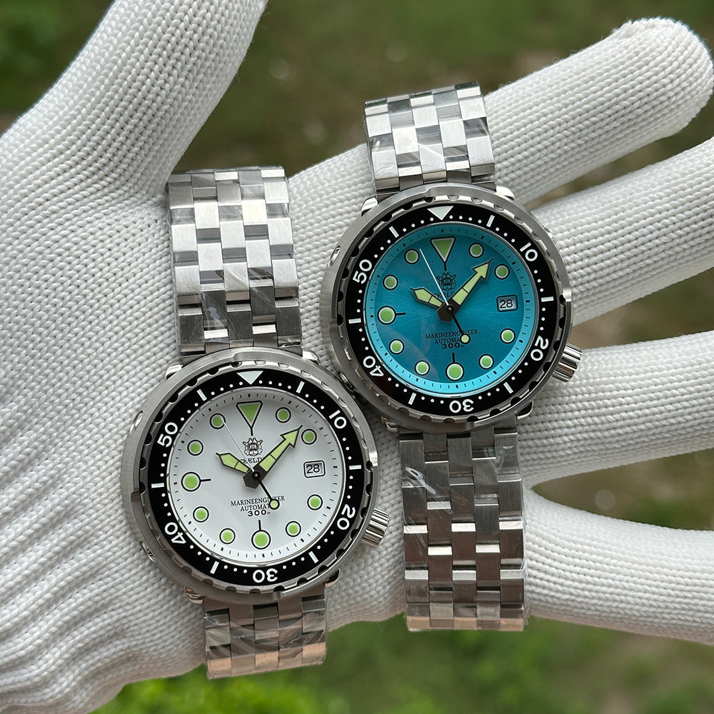Steeldive SD1975 tuna pair compared: white dial and ice blue dial on steel bracelets, top view