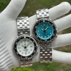 Steeldive SD1975 tuna pair compared: white dial and ice blue dial on steel bracelets, top view