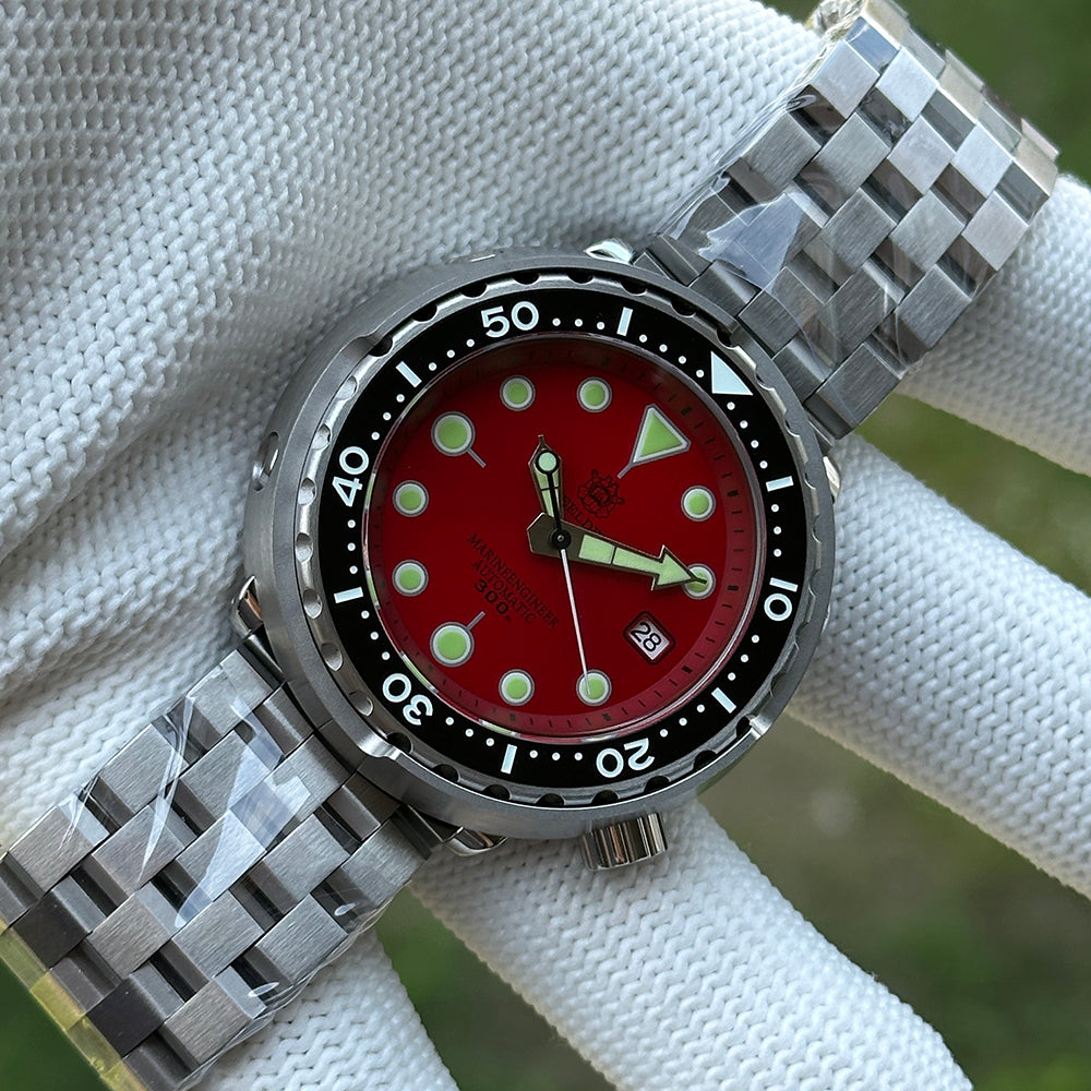 Steeldive SD1975 red sunray dial on jubilee bracelet, angled outdoor lifestyle shot