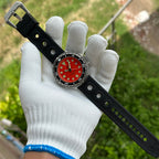 Steeldive SD1975 tuna watch matte orange dial worn with black rubber strap, outdoor wrist shot