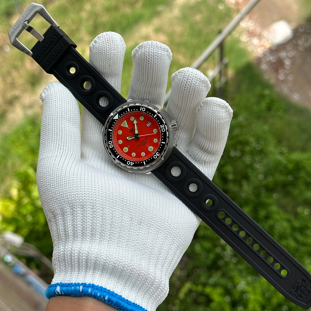 Steeldive SD1975 tuna watch matte orange dial worn with black rubber strap, outdoor wrist shot