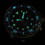 Steeldive SD1975 tuna watch lume shot showing green BGW9 indices and blue bezel pip in the dark