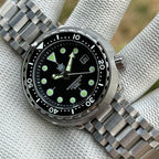 STEELDIVE SD1975K black dial and ceramic bezel on a tank bracelet, dial marked Automatic 300m