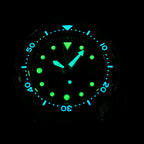 STEELDIVE SD1975K lume shot with hands, markers and bezel glowing green and blue in the dark